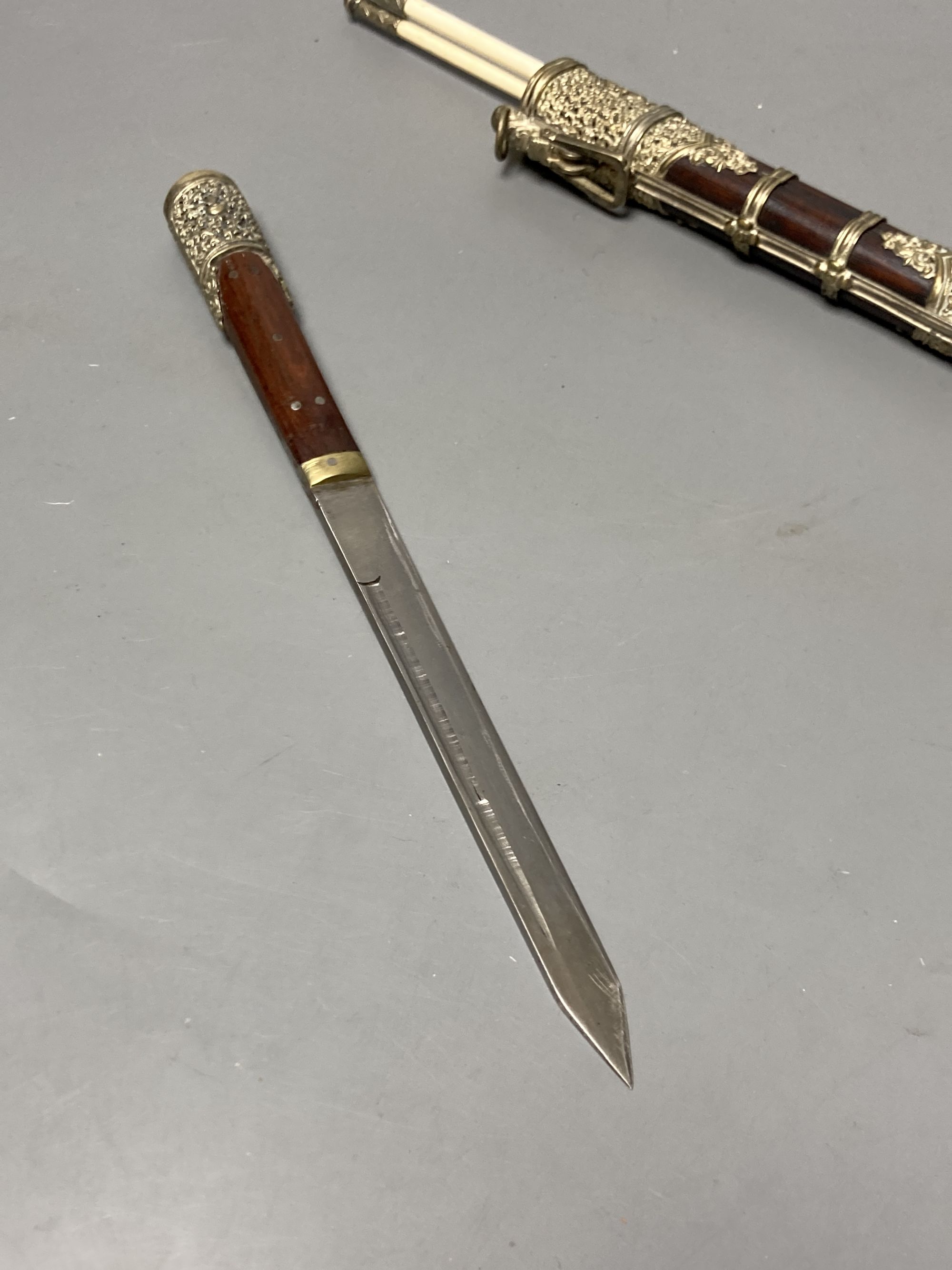 A Tibetan rosewood and white metal mounted chopsticks and knife set